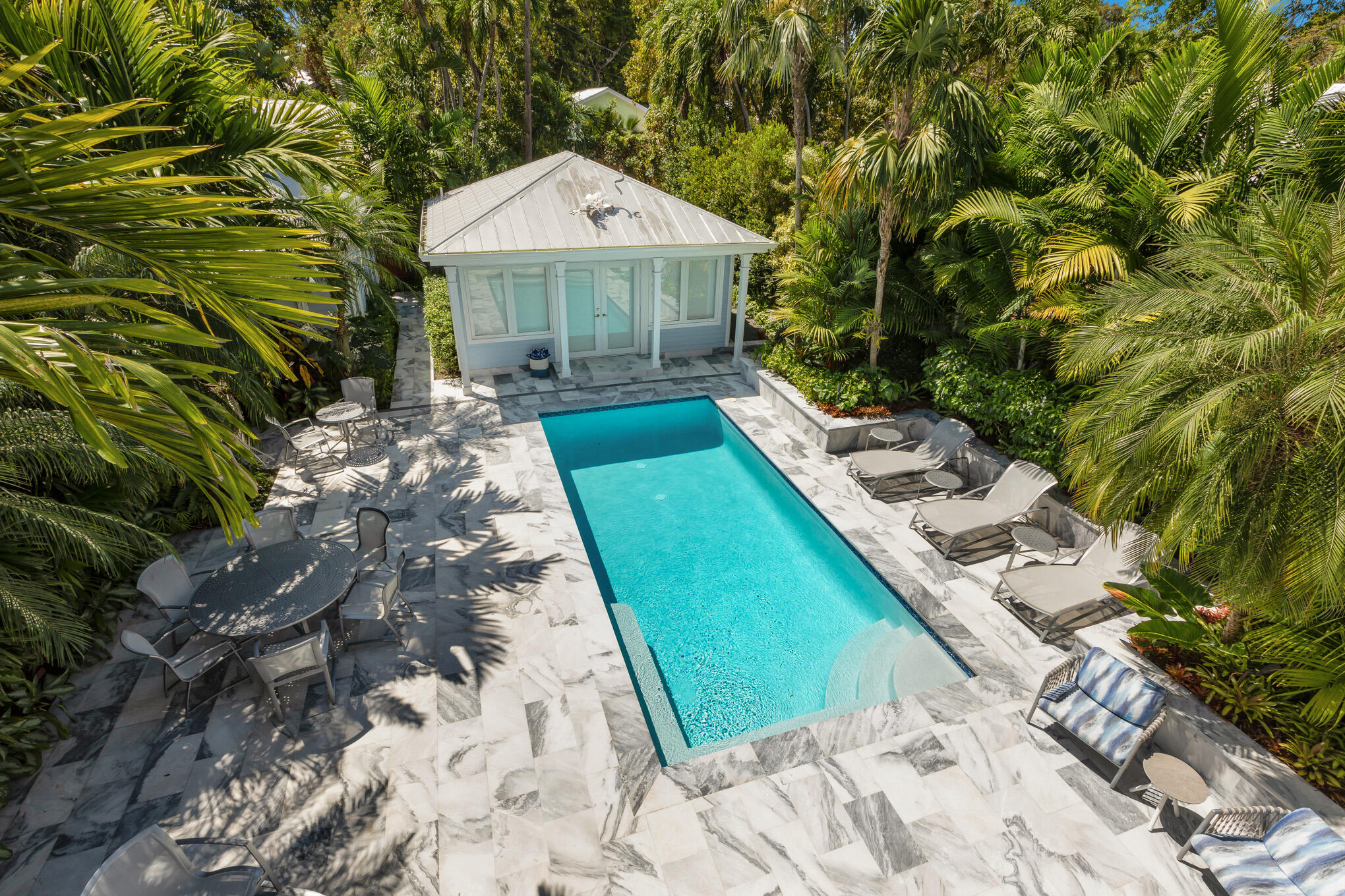 626 William Street Key West, FL 33040 - Photo 17 of 68 a view of a backyard with plants and a patio