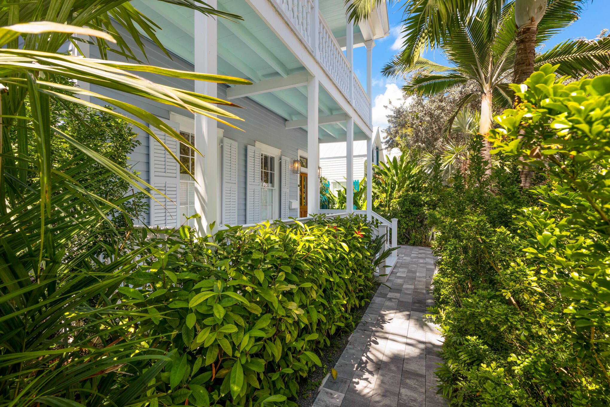 626 William Street Key West, FL 33040 - Photo 3 of 68 a view of a pathway of a house with a garden