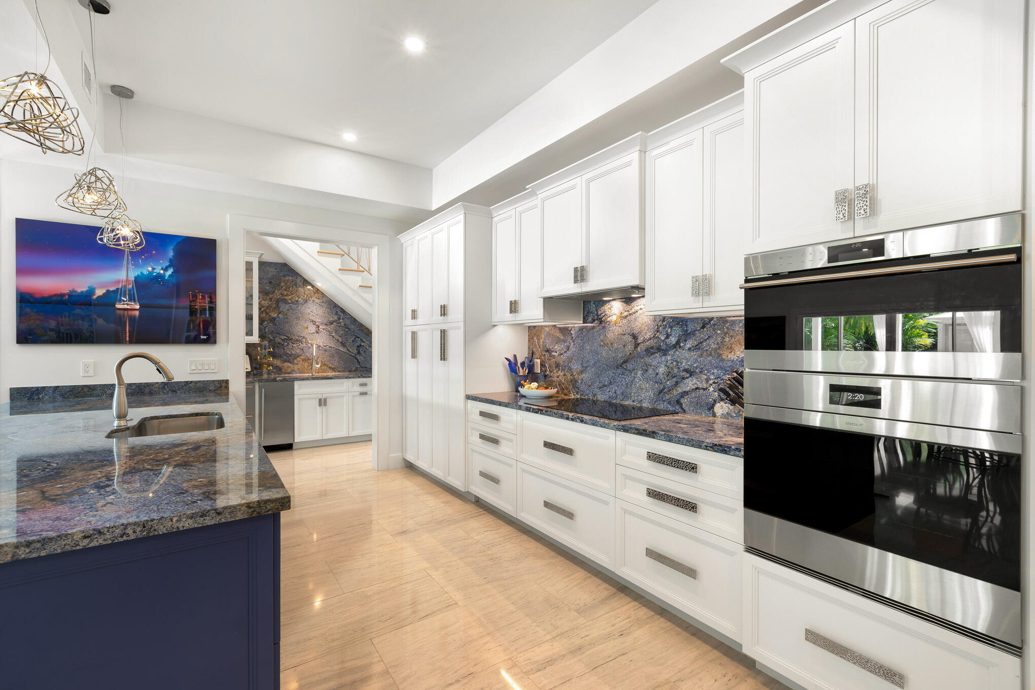 626 William Street Key West, FL 33040 - Photo 43 of 68 a kitchen with stainless steel appliances kitchen island granite countertop a sink and a stove