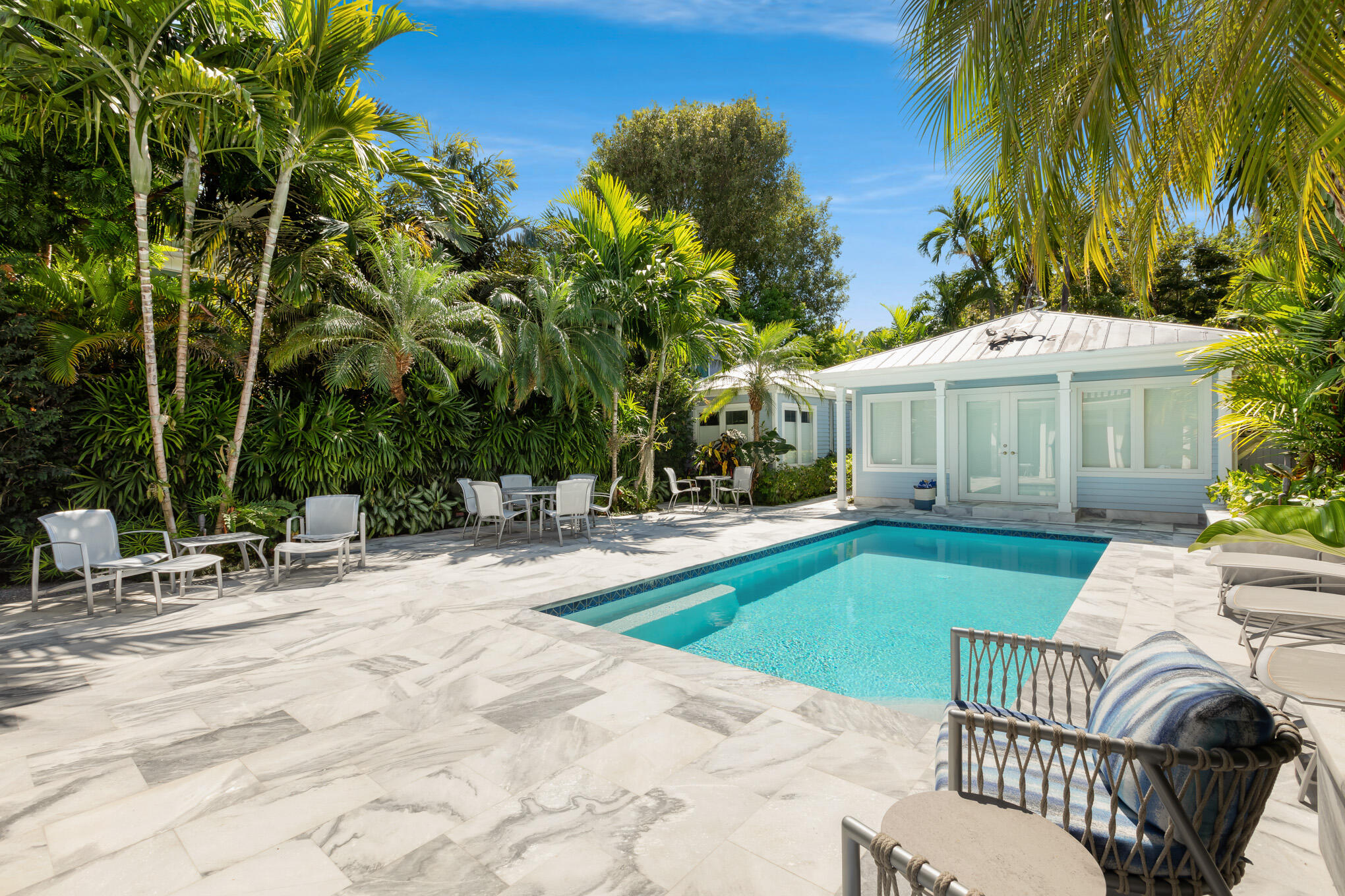 626 William Street Key West, FL 33040 - Photo 52 of 68 a view of a house with swimming pool and sitting area