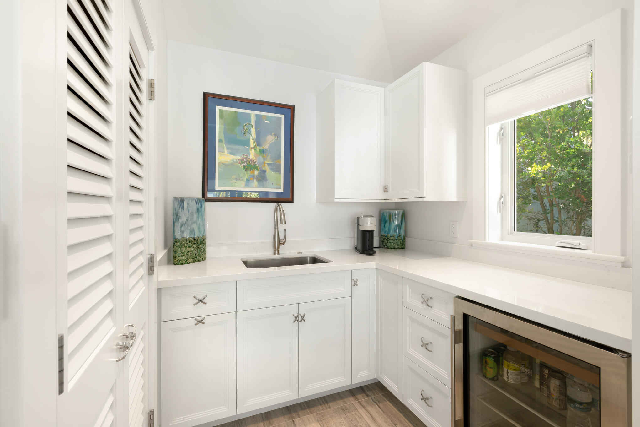 626 William Street Key West, FL 33040 - Photo 60 of 68 a kitchen with stainless steel appliances white cabinets and a window
