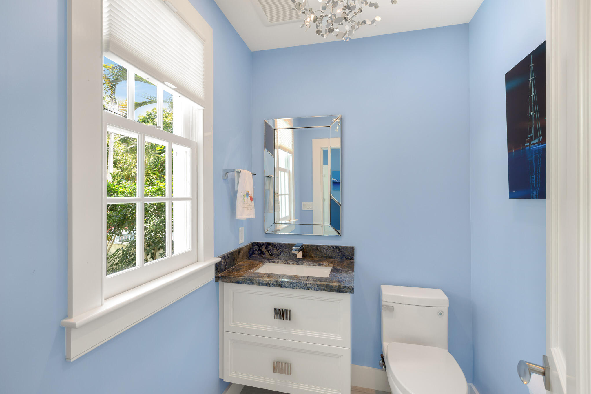 626 William Street Key West, FL 33040 - Photo 8 of 68 a bathroom with a granite countertop toilet a sink and a window