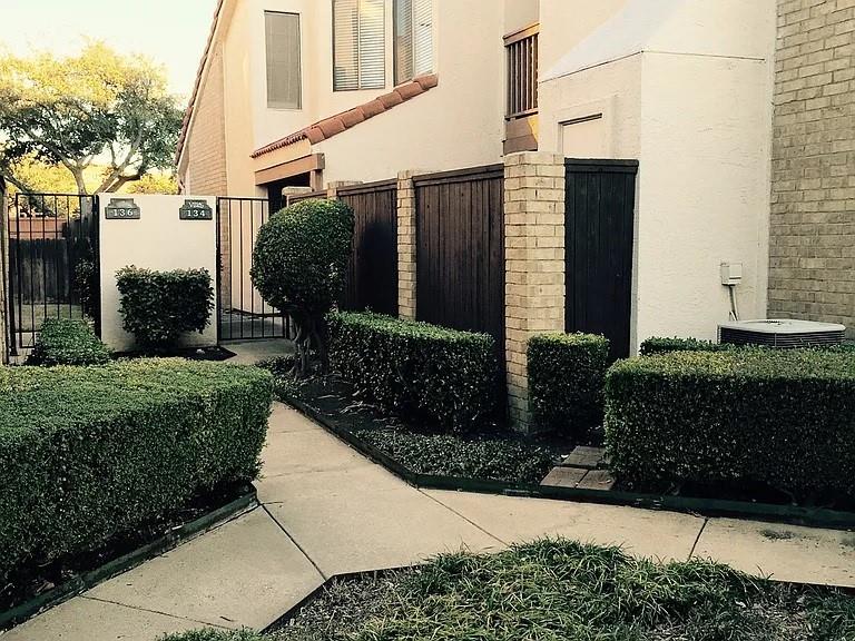 519 Ranch Trail, Unit 134 Irving, TX 75063 - Photo 1 of 20 a front view of a house with a yard