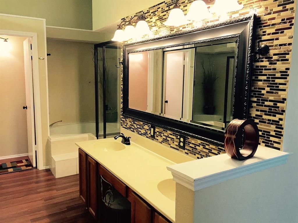 519 Ranch Trail, Unit 134 Irving, TX 75063 - Photo 6 of 20 a bathroom with a sink and a mirror