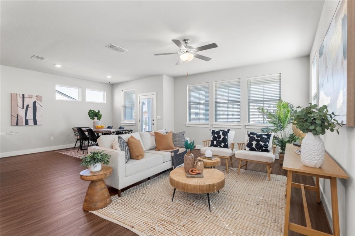 7402 Harmony Shoals Bend Austin, TX 78744 - Photo 1 of 1 a living room with furniture and a wooden floor
