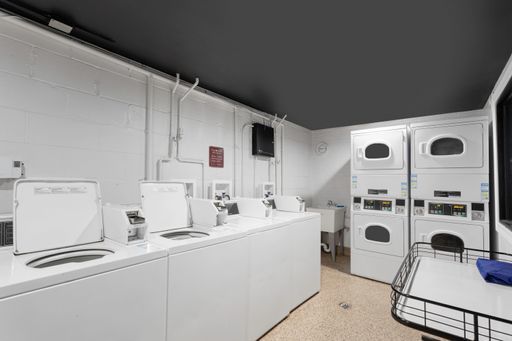 6758 North Sheridan Road, Unit 438 Chicago, IL 60626 - Photo 11 of 12 a view of living room with furniture and washer