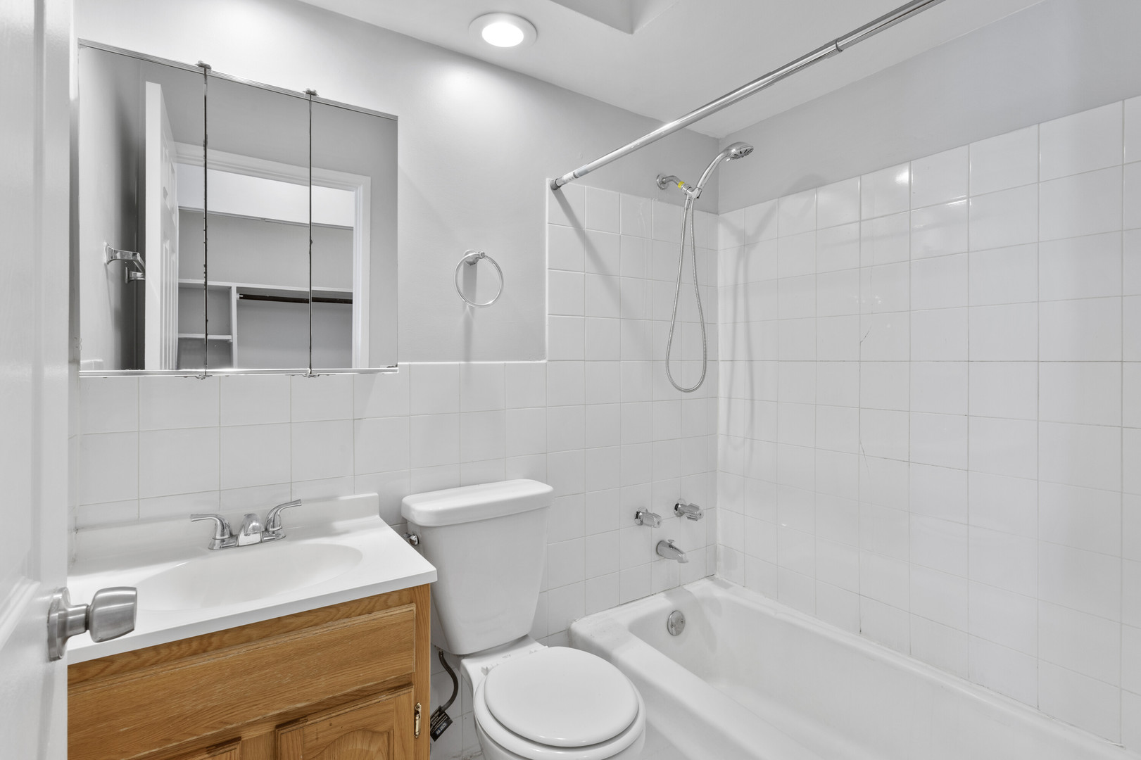 6758 North Sheridan Road, Unit 438 Chicago, IL 60626 - Photo 8 of 12 a bathroom with a sink toilet and shower