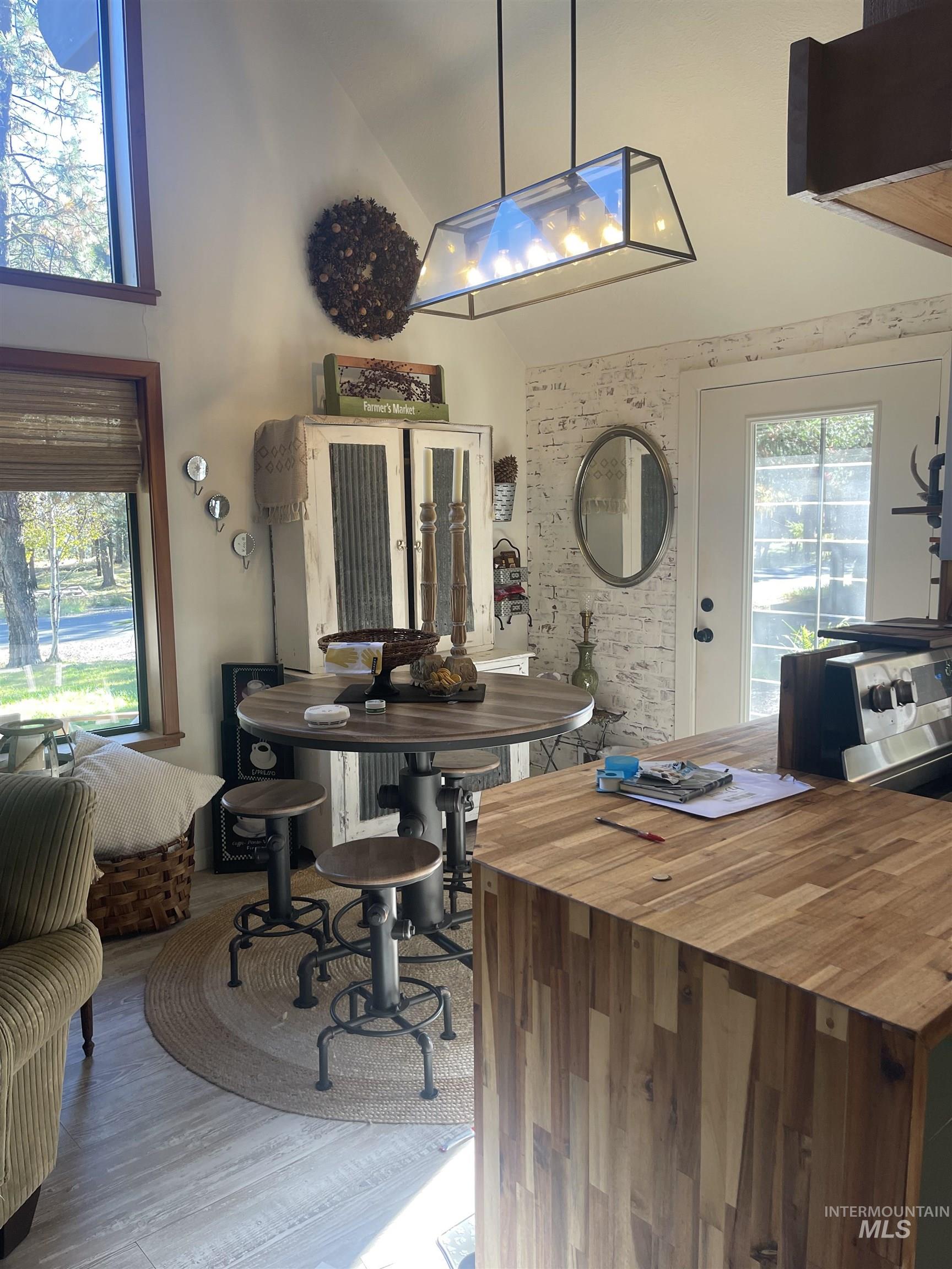 306 Rio Vista Boulevard McCall, ID 83638 - Photo 13 of 40 Dining area with high vaulted ceiling and light wood finished floors