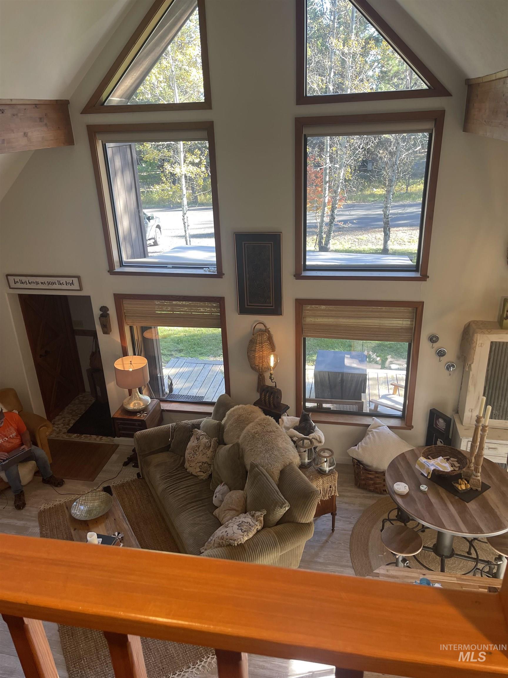306 Rio Vista Boulevard McCall, ID 83638 - Photo 32 of 40 Living room featuring high vaulted ceiling and plenty of natural light