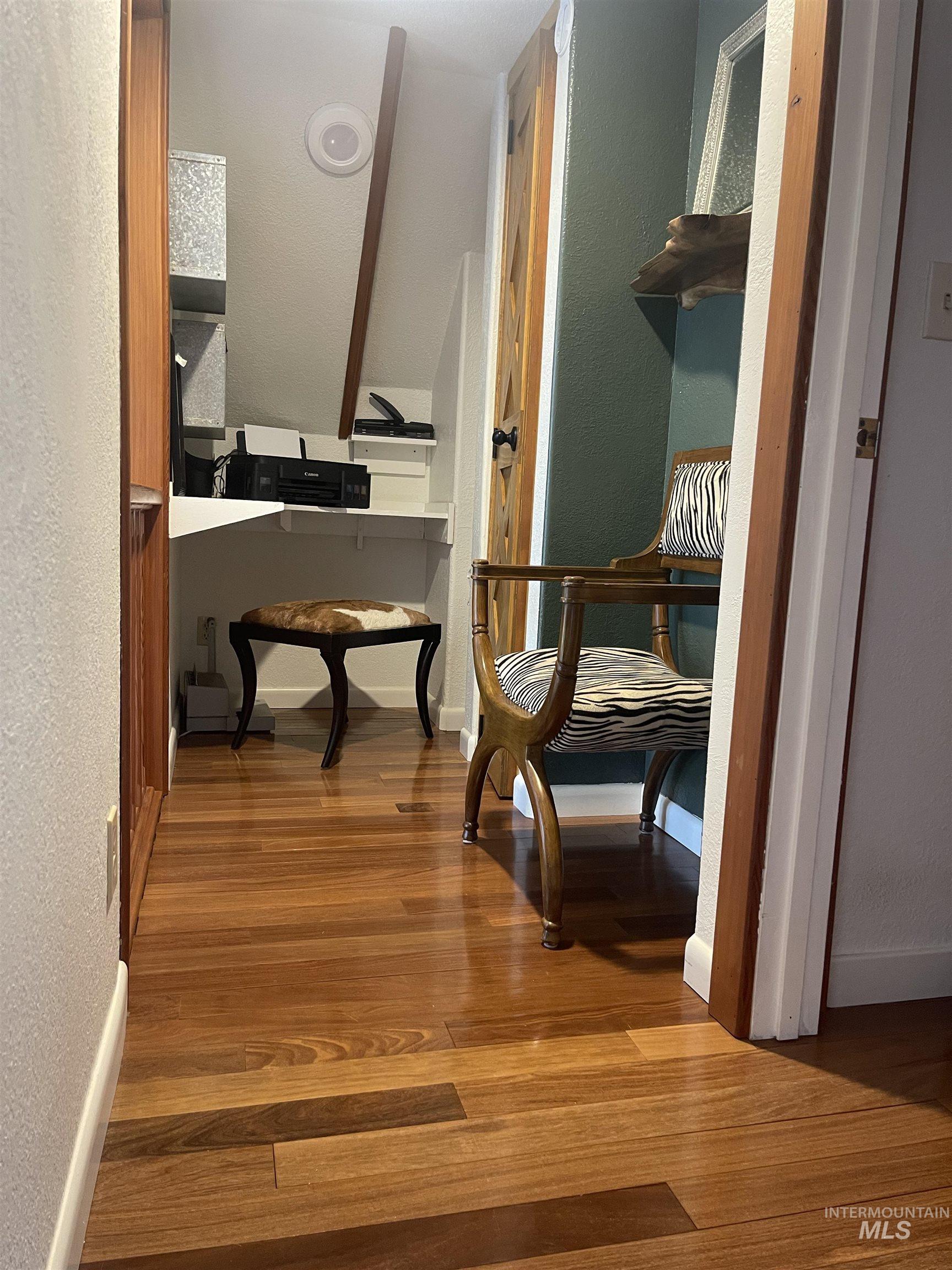 306 Rio Vista Boulevard McCall, ID 83638 - Photo 33 of 40 Sitting room with a textured wall and dark wood-style flooring