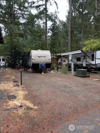 a view of backyard with parked car