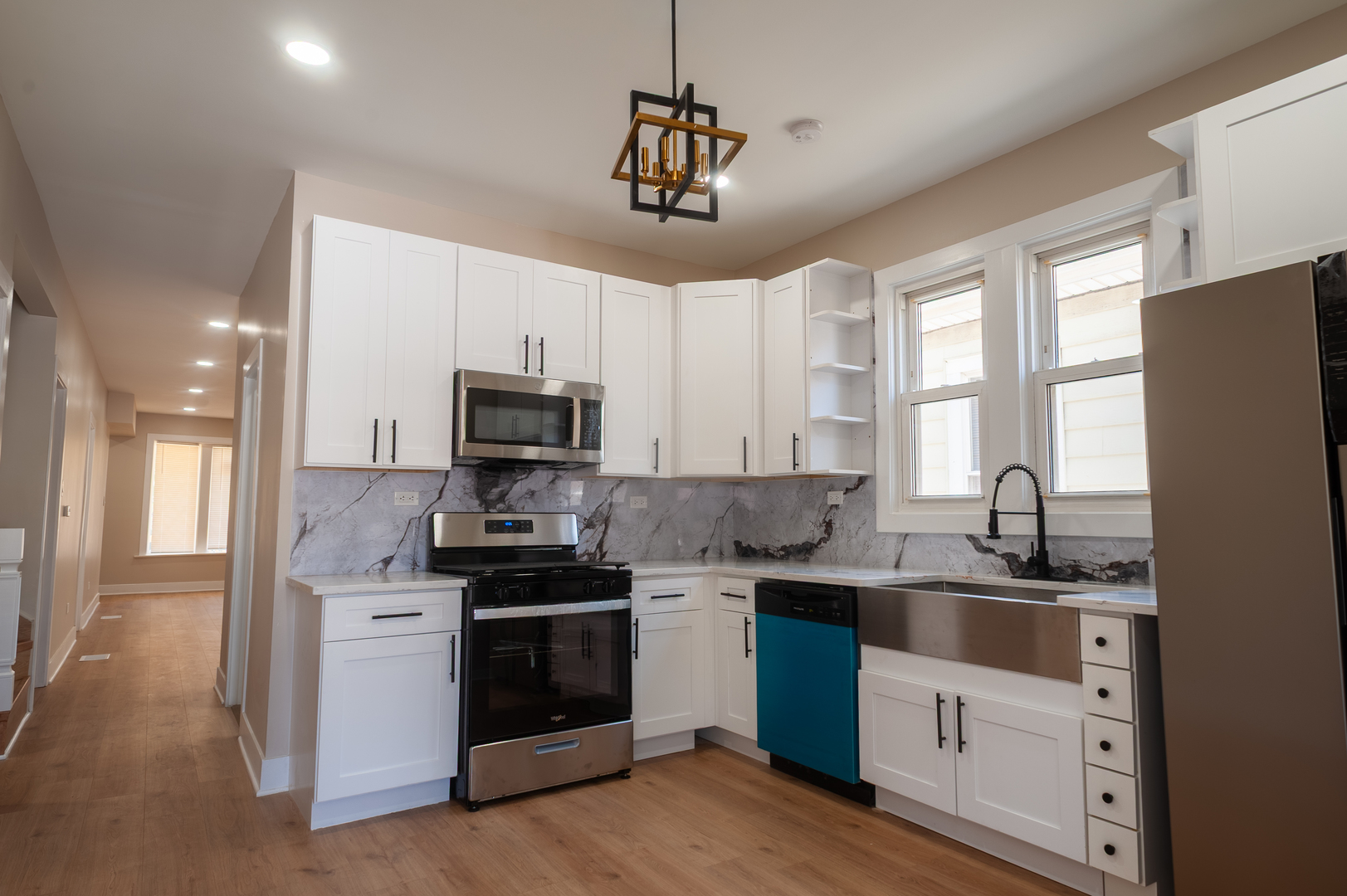 8620 South Union Avenue Chicago, IL 60620 - Photo 20 of 41 a kitchen with stainless steel appliances granite countertop a sink a stove a refrigerator cabinets and a window