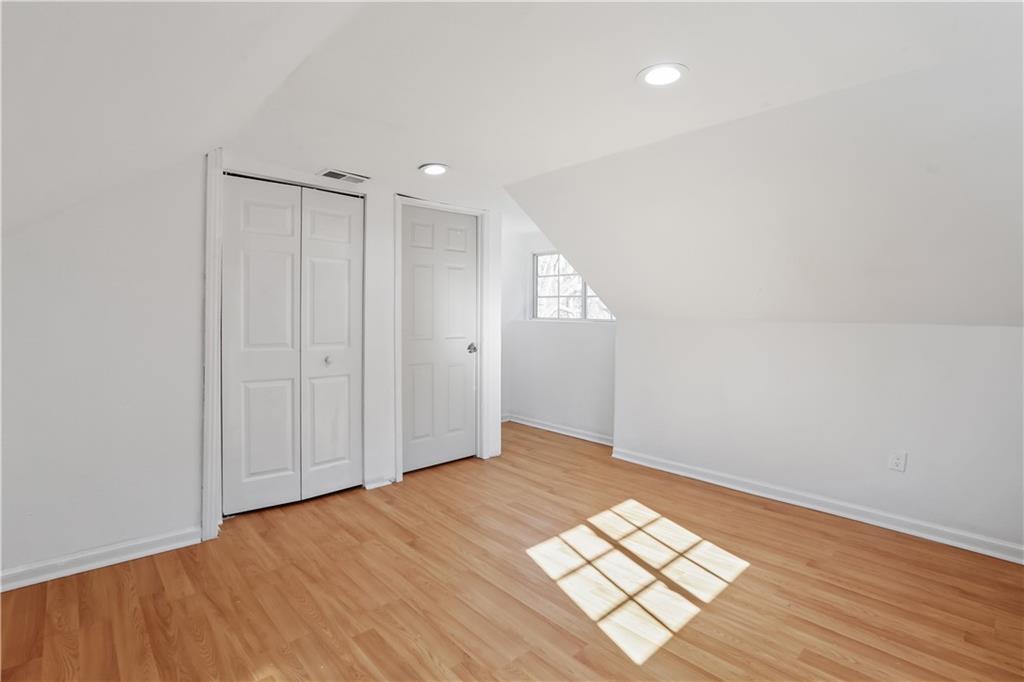 1512 Flat Shoals Road Atlanta, GA 30349 - Photo 13 of 35 wooden floor in an empty room with a window