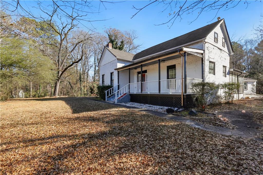 1512 Flat Shoals Road Atlanta, GA 30349 - Photo 25 of 35 a view of a house with a yard