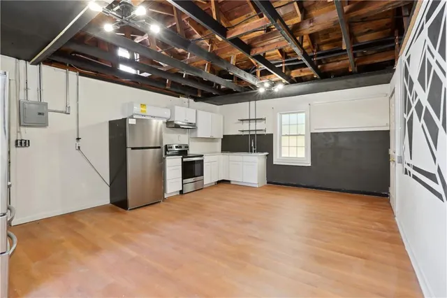 a view of a refrigerator in a kitchen