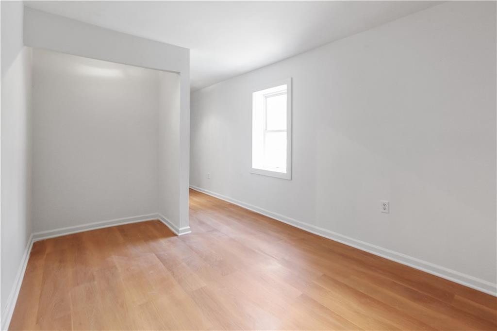 1512 Flat Shoals Road Atlanta, GA 30349 - Photo 34 of 35 an empty room with a window