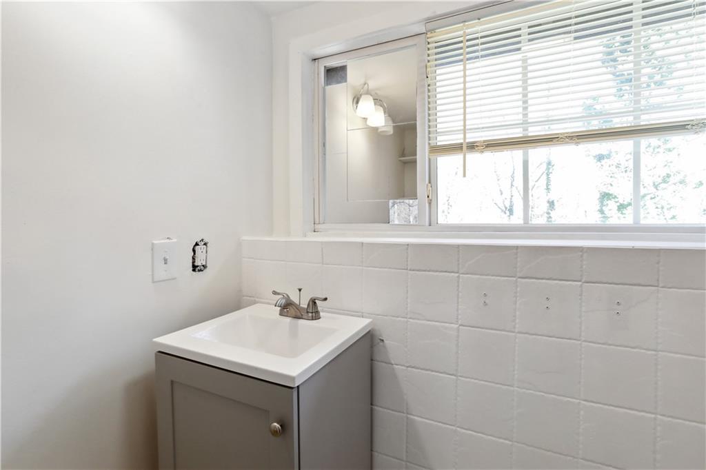1512 Flat Shoals Road Atlanta, GA 30349 - Photo 35 of 35 a bathroom with a sink and a vanity