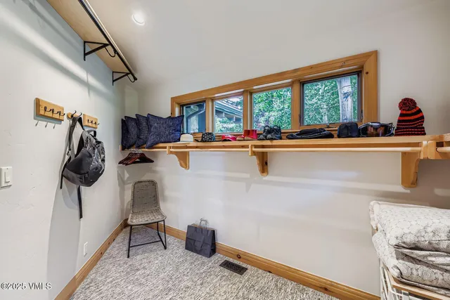 a view of a living room and workspace