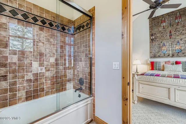 a bathroom with a bathtub and a shower
