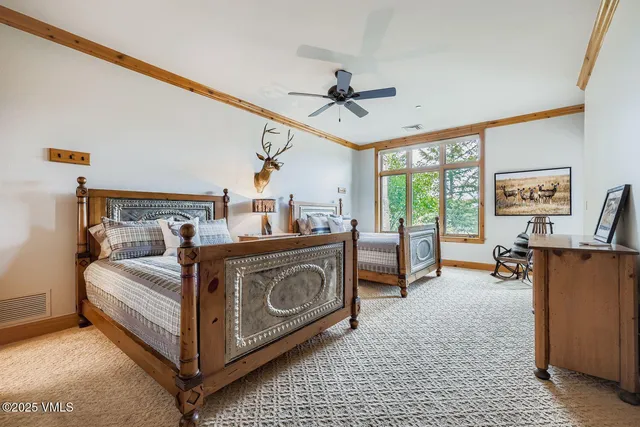 a bed room with a bed and a chair