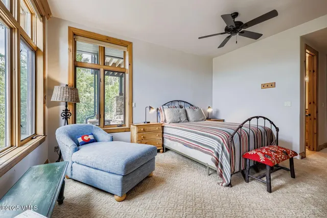 a bedroom with bed and a window