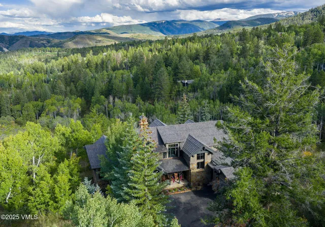 a view of a back yard from a garden