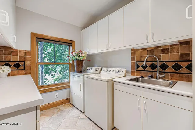a utility room with dryer and washer