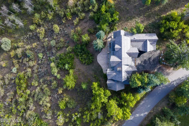 an aerial view of a house with a garden