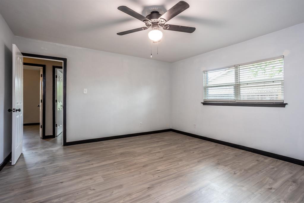 1206 Oakbluff Drive Lancaster, TX 75146 - Photo 13 of 23 Master bedroom with high windows on bed wall.
