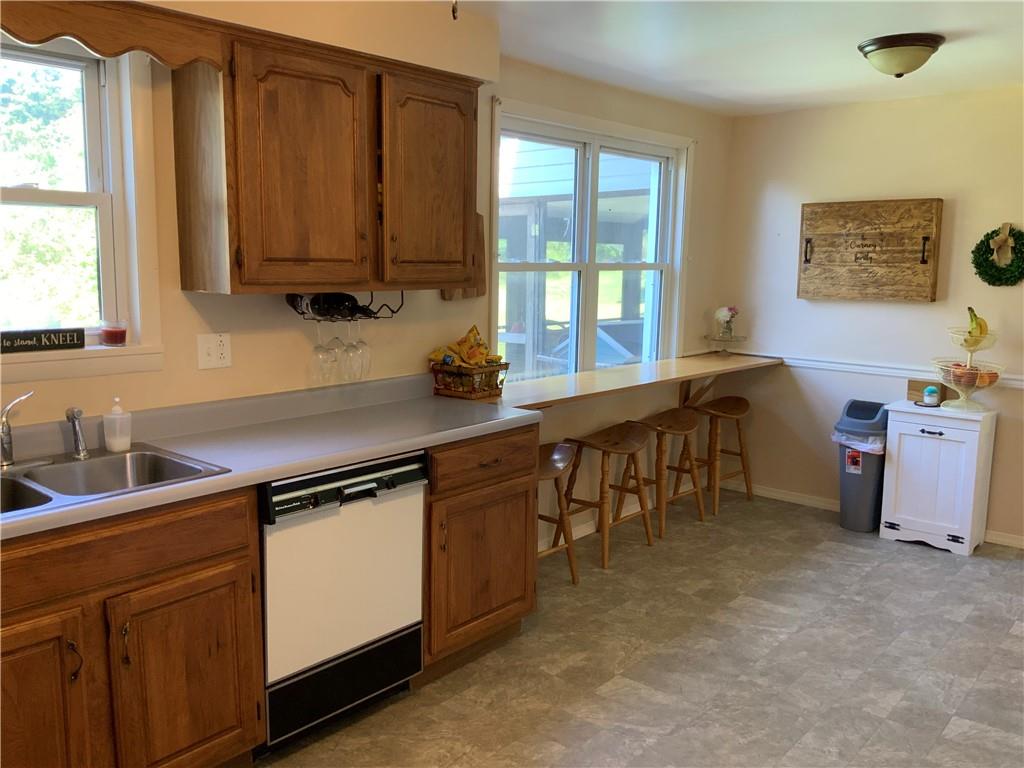 120 Coolspring Road Indiana, PA 15701 - Photo 6 of 23 a kitchen with kitchen island granite countertop a sink stove and cabinets