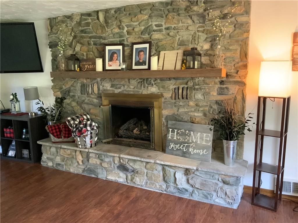 120 Coolspring Road Indiana, PA 15701 - Photo 9 of 23 a living room with furniture wooden floor and a fireplace