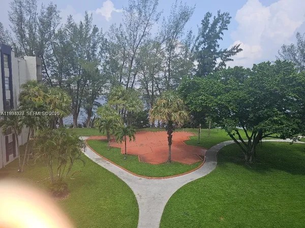 a view of a garden with trees