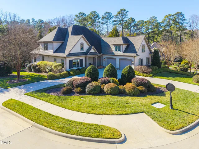 a front view of a house with a yard and porch