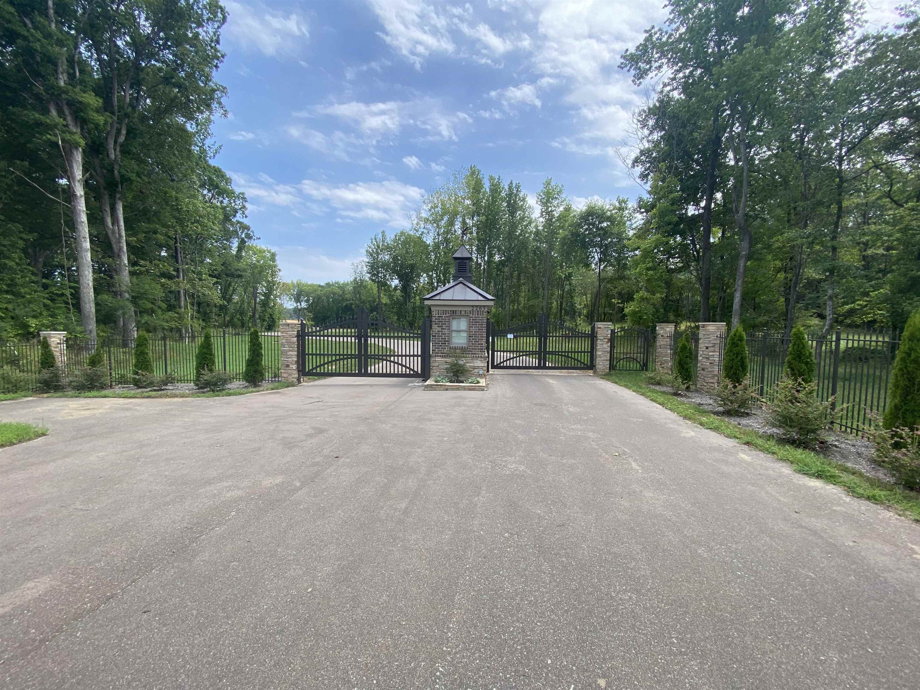 a view of a road with a building in the background