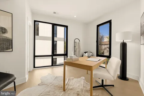 a view of a workspace with furniture