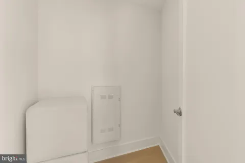 a view of an entryway with wooden floor