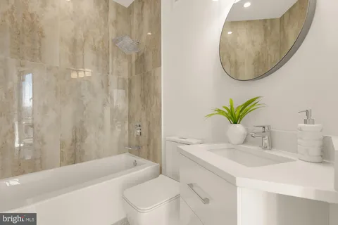 a bedroom with a bed and a mirror