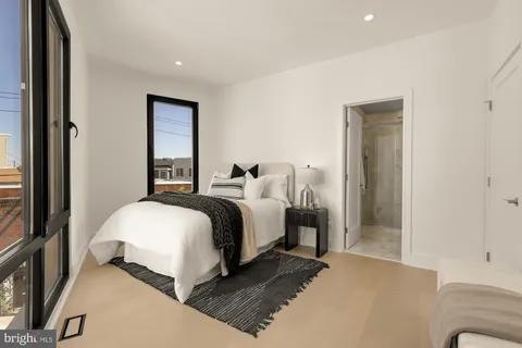 a bathroom with a shower and a shower curtain