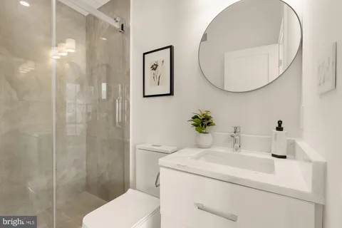 a view of balcony with a floor to ceiling window and brick wall