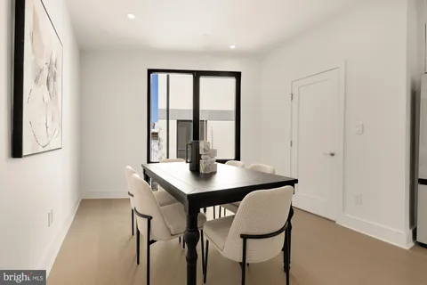 a view of a workspace with furniture and window