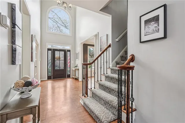 a view of a livingroom with furniture and stairs