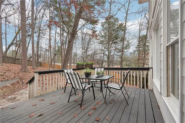 a view of a deck with furniture and wooden floor