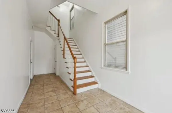 a view of a hallway with staircase
