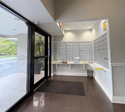 a kitchen with a sink a stove a microwave cabinets and a window
