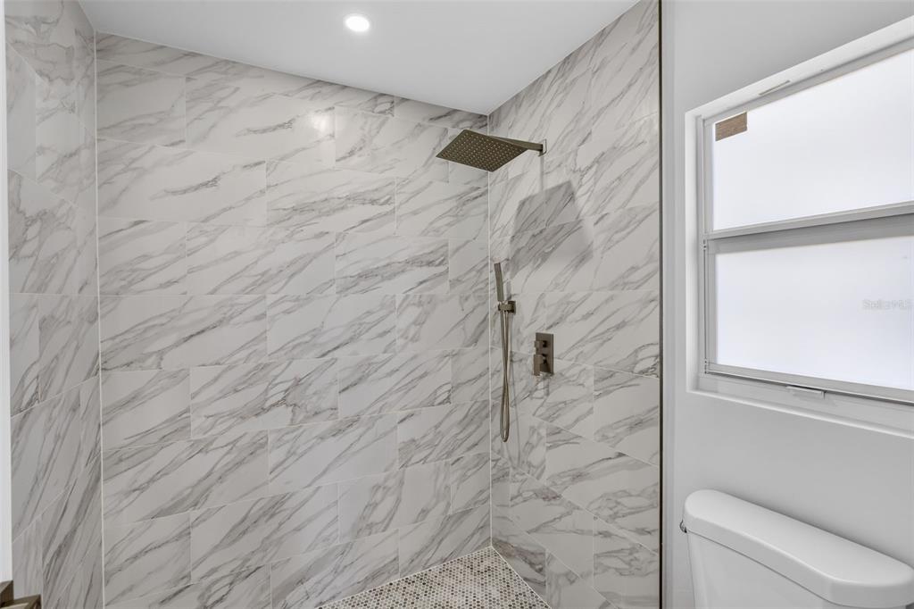 375 Denver Drive Port Charlotte, FL 33954 - Photo 19 of 37 a bathroom with a shower