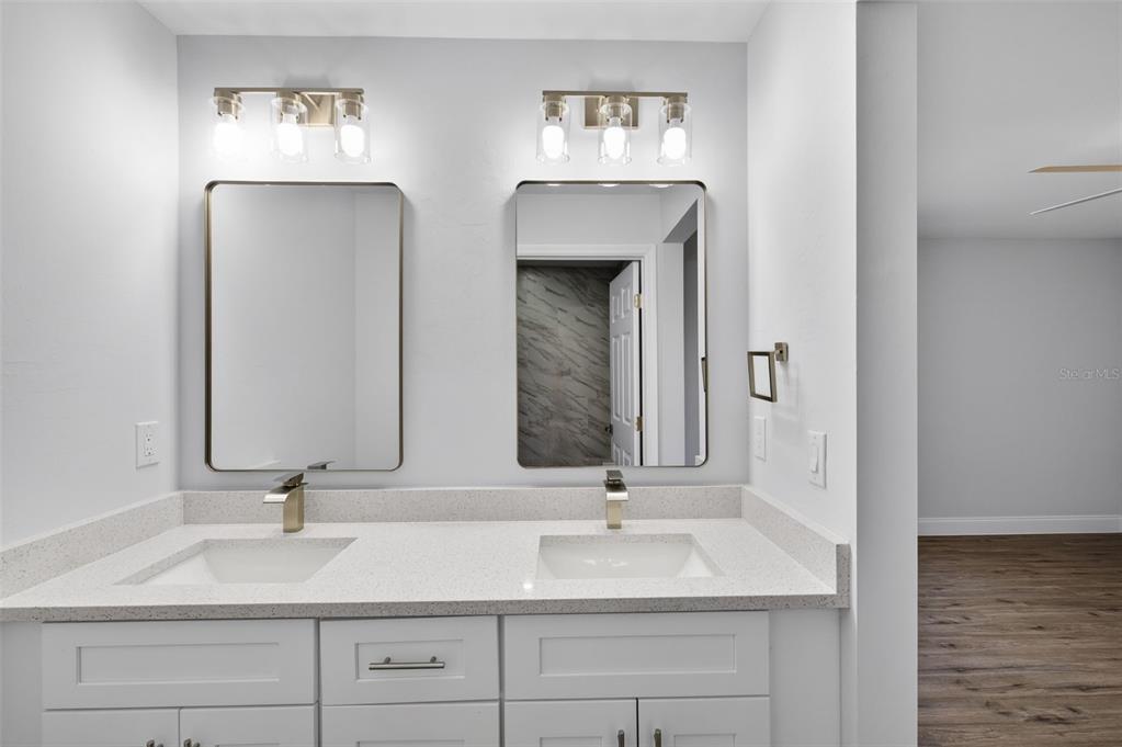 375 Denver Drive Port Charlotte, FL 33954 - Photo 20 of 37 a bathroom with double vanity sinks and a mirror