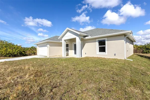 a view of a house with a yard