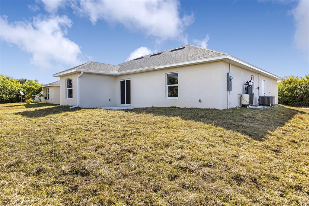 375 Denver Drive Port Charlotte, FL 33954 - Photo 36 of 37 a view of a house with a yard