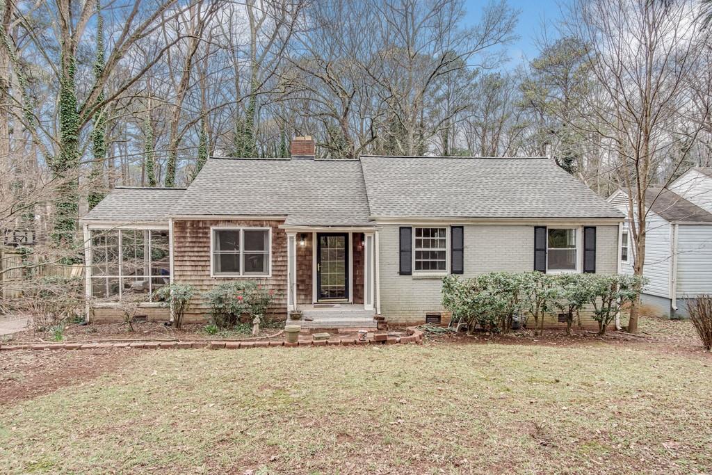 1231 Carter Road Decatur, GA 30030 - Photo 1 of 1 front view of a house with a yard