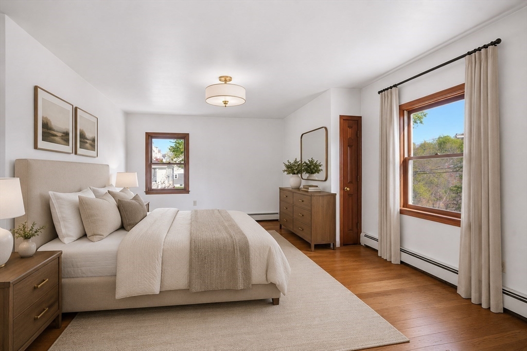67 Wituwamat Road Weymouth, MA 02191 - Photo 27 of 42 a bedroom with a large bed and a window